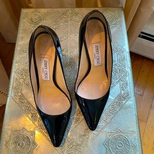 Black patent leather Jimmy Choo pump.